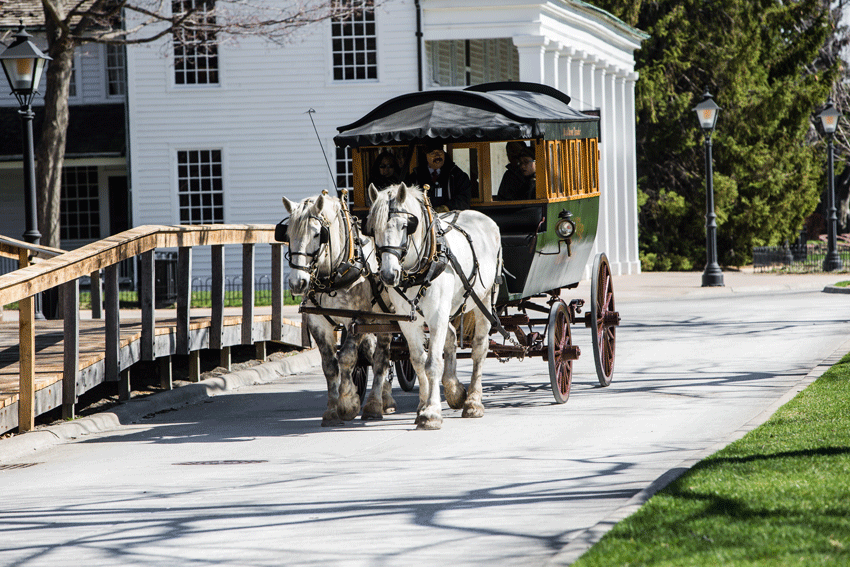 Carriage-Ride-Passes-Eagle-Tavern-inside-Greenfield-Village